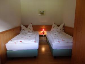 A bed or beds in a room at Sportlerhof