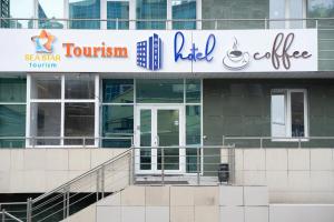 a building with a sign on the side of it at Sea Star Boutique Hotel in Almaty +33 photos