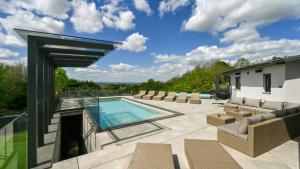 a patio with a swimming pool and chairs and a house at Villa Lady Berga by Villas Guide in Ludbreg