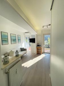 a living room with a couch and a table at Casa Leone sea&terrace in Bogliasco
