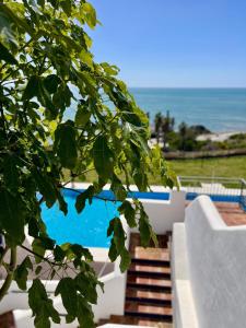 a view of the ocean from the balcony of a house at Best Vistamar Sea View in Torrox Costa