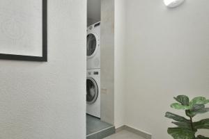 a laundry room with a washer and dryer at Studio The Waterfall - Free Parking in Balchik