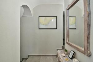 a hallway with a mirror and a sink and stairs at Studio The Waterfall - Free Parking in Balchik