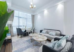 a living room with a couch and a table at Bohemian Rhapsody in Kuwait