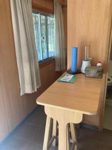 a wooden table in a room with a window at Complejo Orejano in Mercedes +25 photos