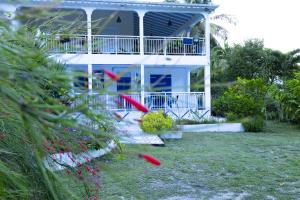 a house with red frisbees in front of it at VILLA EDEN Gosier in Le Gosier