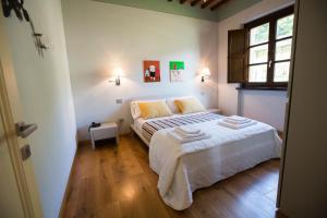 A bed or beds in a room at Spa Resort Fonte Alla Lepre