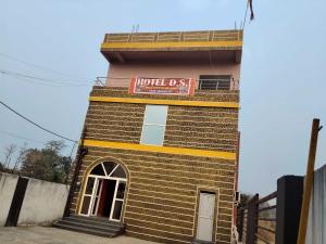 a brick building with a sign that reads hotel class at Hotel O D S in Rāmgarh +3 photos