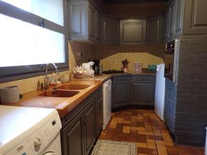 a kitchen with a sink and a counter top at Bramfam in Gresse-en-Vercors