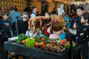 a large turkey being hooked up to a table of vegetables at HUMSON BULOQ SANATORIUM in Khumson +132 photos