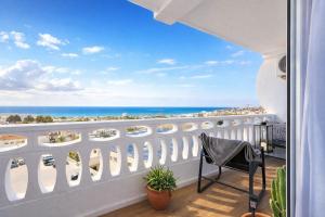 a balcony with a view of the ocean at Amber Signature Apartment in Torrevieja