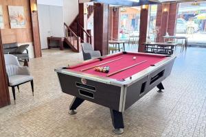 a pool table in the middle of a room at Bokeo Lodge & Restaurant in Ban Houayxay