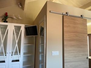 a bathroom with a shower with a sliding glass door at Casa Candida in Samaleo +86 photos
