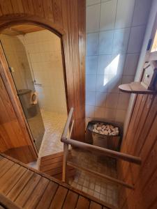 an overhead view of a bathroom with a shower at Narvijärven lomamökki in Rauma