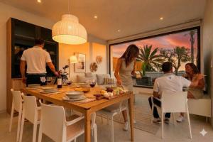 a group of people sitting around a dining room table at Edelweiss in Los Alcázares