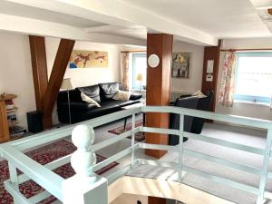 a view of a living room with a glass staircase at Ferienhaus Winkelwerk in Goslar
