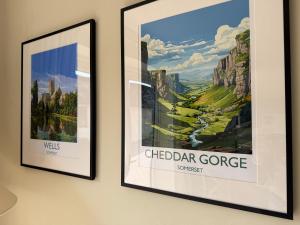 two framed posters hanging on a wall at Lillypool Farm in Shipham