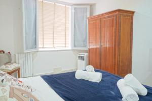 a bedroom with a bed with towels on it at Gest Short Rent Siena 4 in Siena