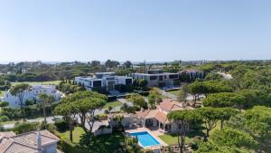 an aerial view of a villa with a resort at Casa Atlantico in Quinta do Lago