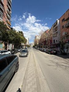a street with cars parked on the side of the road at Apartment 27 in Elbasan
