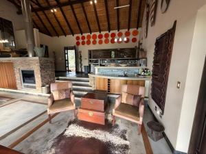 a kitchen with two chairs and a table in a room at Castle View in Pretoria