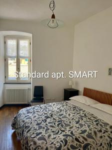 a bedroom with a large bed and a window at La Scala Vernazza CinqueTerre in Vernazza +33 photos