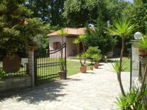 a gate in front of a house with plants at Dodis Village in Platanias