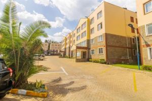 an empty parking lot in front of a building at SarafuDeluxe in Nakuru
