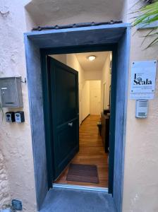 a doorway into a hallway with a door open at La Scala Vernazza CinqueTerre in Vernazza