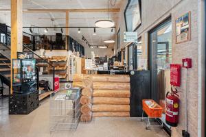 a store with a bunch of logs in a store at Tirol Cabin by ALPAMI in Wildermieming