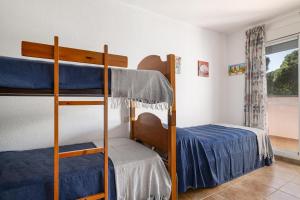 a bedroom with two bunk beds and a bed at Balconera 104 in Novo Sancti Petri +31 photos