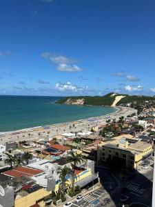 a view of a beach and the ocean at Apartamento 1307 QUALITY HOTEL in Natal +5 photos