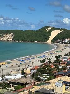 a view of a beach and the ocean at Apartamento 1307 QUALITY HOTEL in Natal