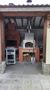 a garage with a brick oven in it at Гостьовий будинок з банею in Bohuslav