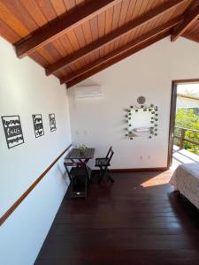 a room with a table and chairs and a window at Casa Vibra Luz Guest House Familiar in Campeche +15 photos
