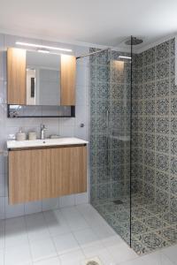 a bathroom with a sink and a shower at Clara Terra in Mytakas +28 photos