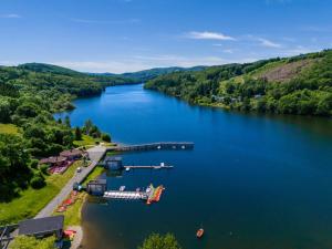an aerial view of a river with a boat in it at Camping des Cèpes in La Salvetat