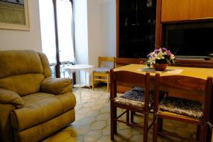 a living room with a couch and a table at La casa dei Percy in Varenna +25 photos