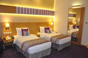Postel nebo postele na pokoji v ubytování Fortune Park Hotel