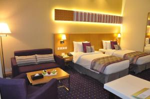 Postel nebo postele na pokoji v ubytování Fortune Park Hotel