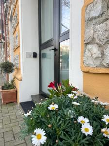 a bunch of flowers in front of a door at La Campanula in La Spezia