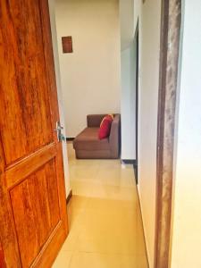an open door to a living room with a couch at Banana Leaf Villa in Nikawatawana
