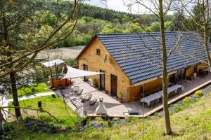 an overhead view of a building with a solar roof at Diófaliget Guesthouse in Pogány