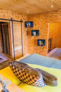 a room with a bed with a shoe on the floor at LOFT d'exception Hypercentre avec Piscine in Brive-la-Gaillarde