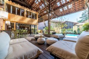a bedroom with two beds and a pool at LOFT d'exception Hypercentre avec Piscine in Brive-la-Gaillarde