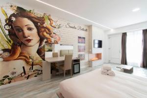 a bedroom with a mural of a woman on the wall at Max Motel - Art Gallery Room in Druento