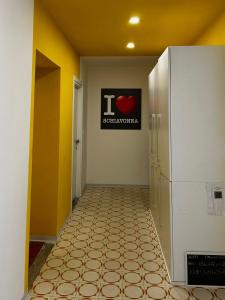 an empty hallway with a sign on the wall at CORFÙ 19 Bed & Breakfast in Schiavonea +12 photos