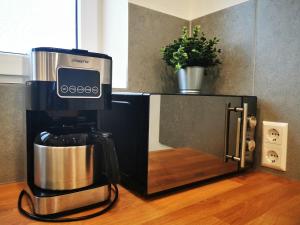 a coffee maker sitting on top of a counter at Gemütliches Souterrain in Langenargen in Langenargen +19 photos