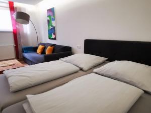 a living room with two beds and a couch at Gemütliches Souterrain in Langenargen in Langenargen
