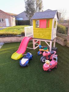 a group of toy cars and a play house at Up de platse in Lo-Reninge